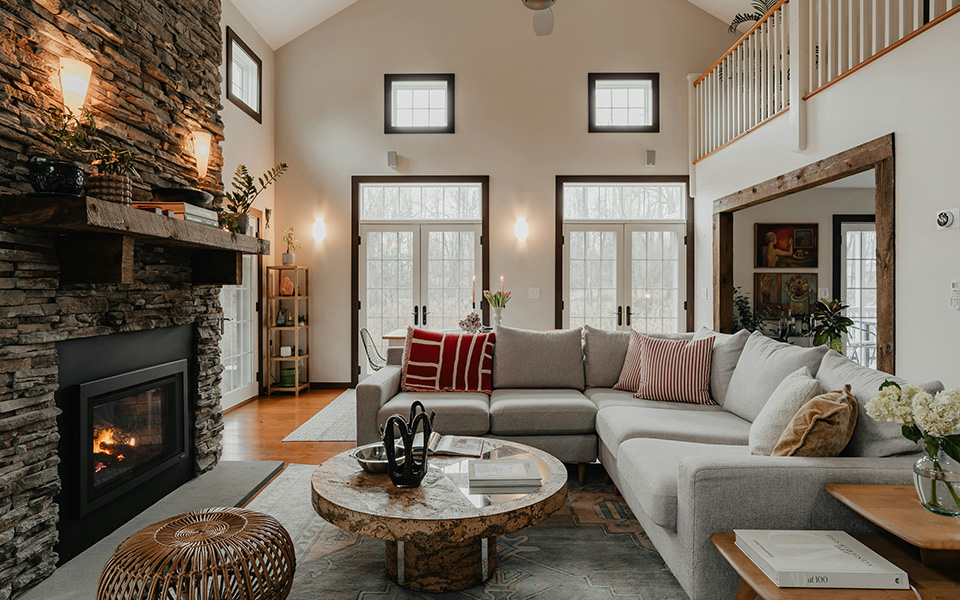 Cozy, inviting living room with fireplace and open loft space